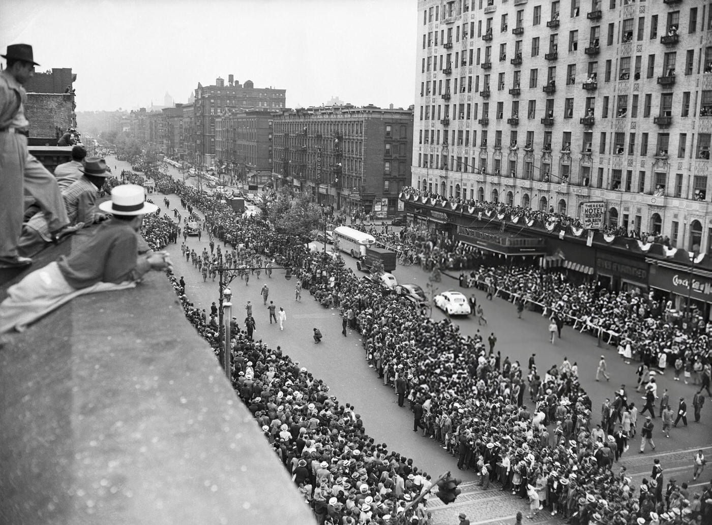 Harlem turned out to honor Joe Louis, a parade along Seventh Avenue featured marchers, cars and floats, 1946.