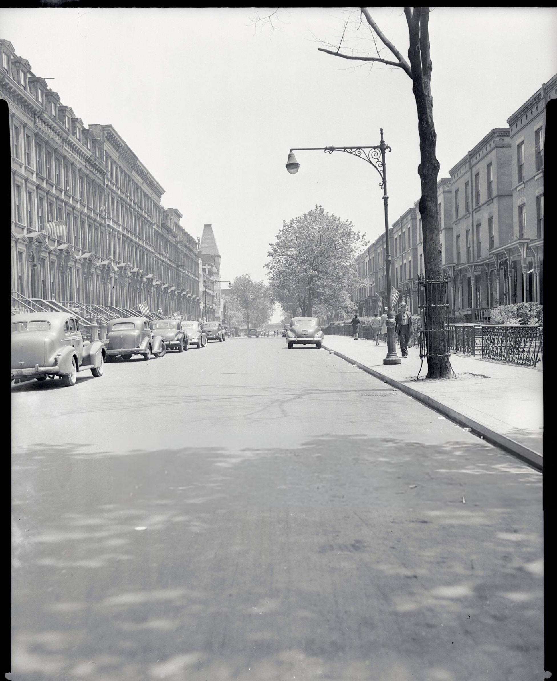 One hundred and twenty-ninth street in Harlem with prosperous homes, 1940s.
