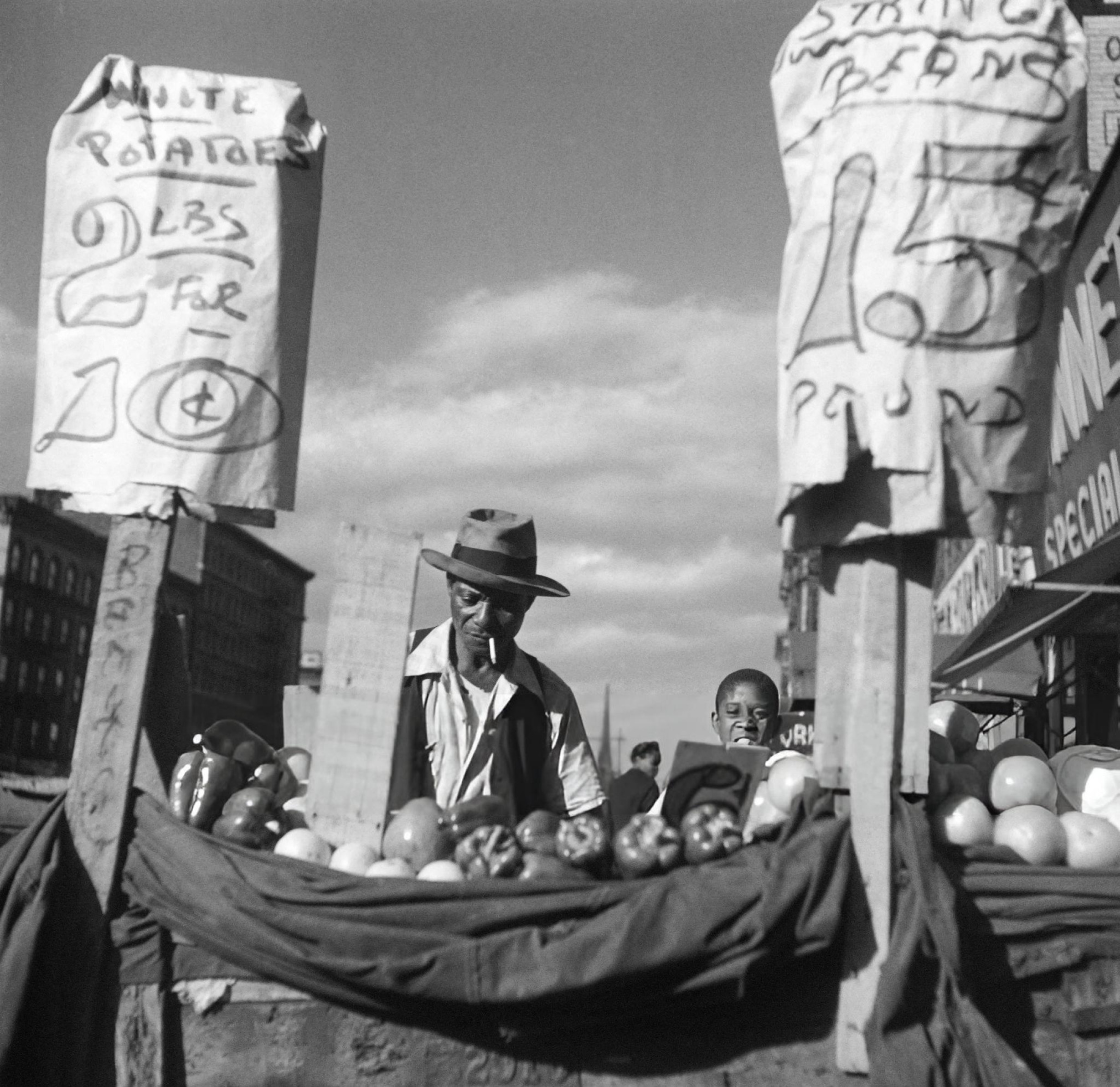 A street vendor sells fruits and vegetables in Harlem, Manhattan, 1946.
