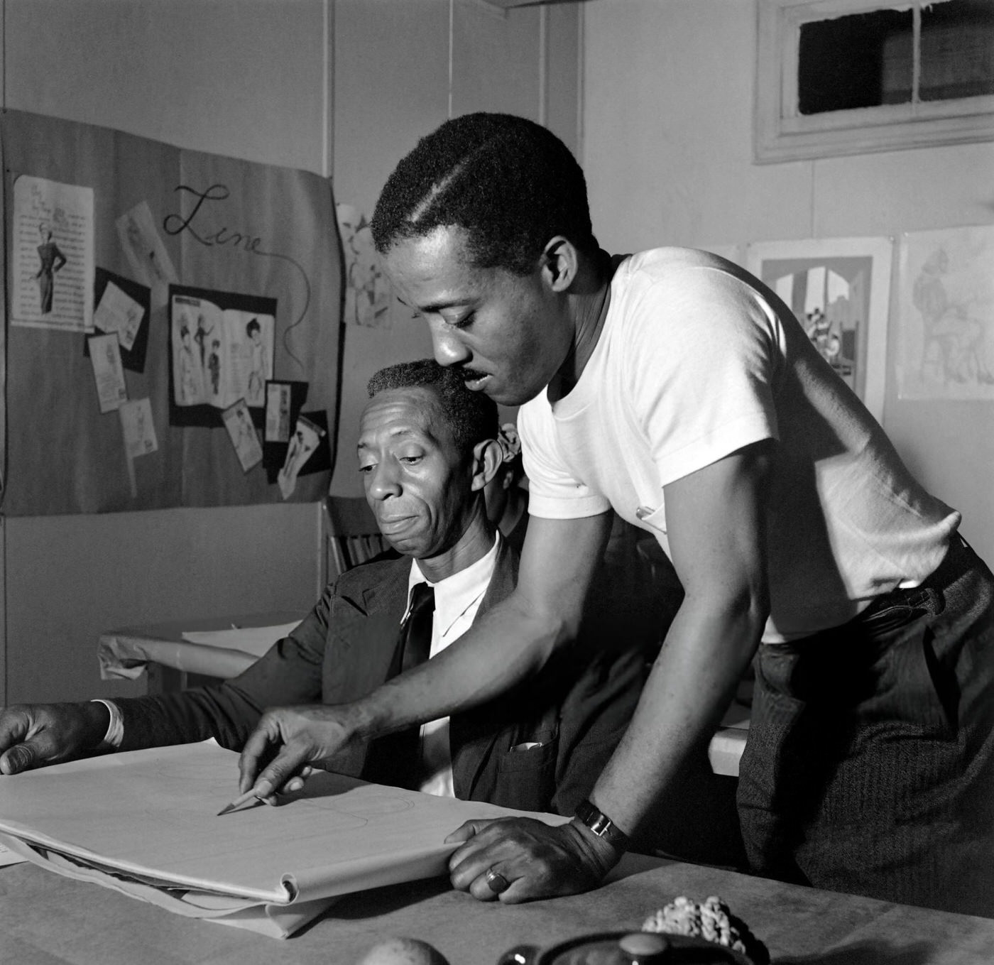 An African American man takes a drawing lesson in Harlem, Manhattan, 1946.