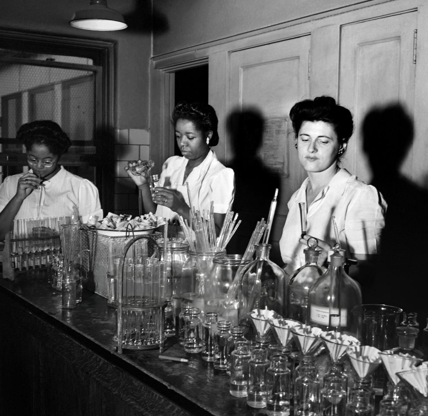 Women work in a hospital's laboratory in Harlem, Manhattan, 1946.