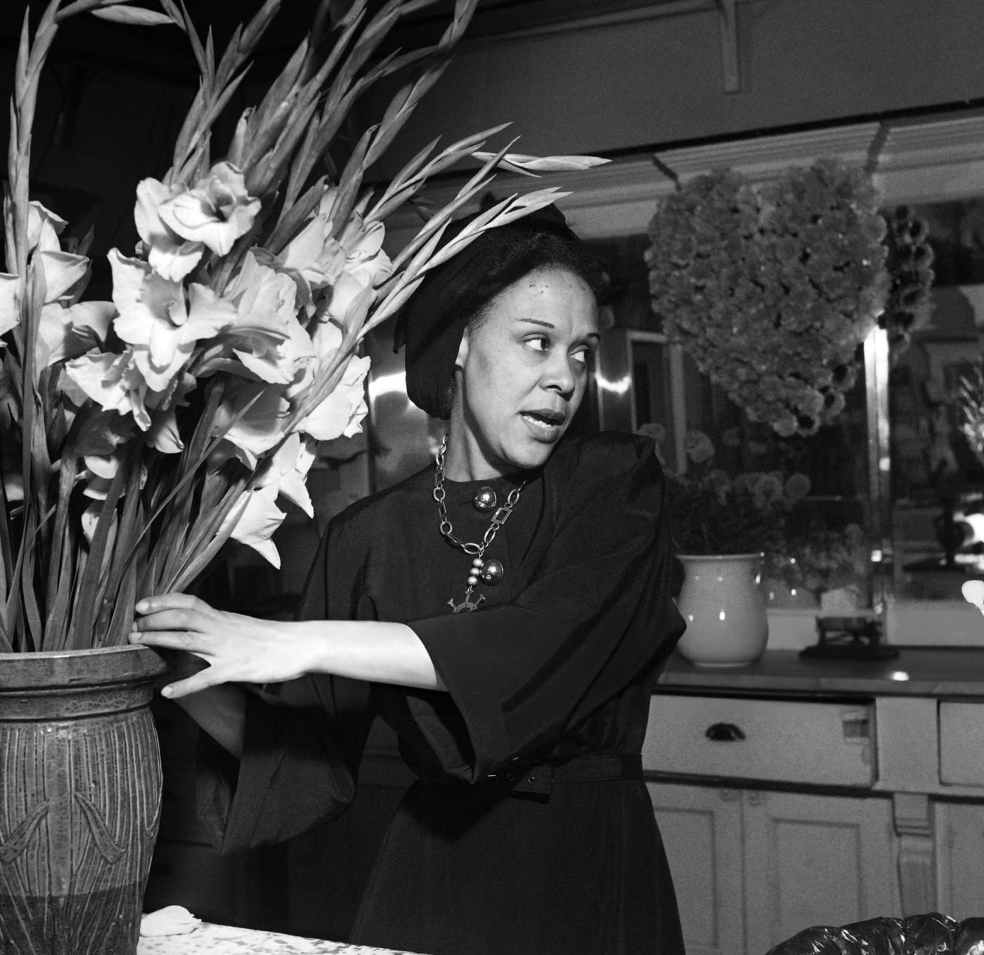 A florist works in her flower shop in Harlem, Manhattan, 1946.