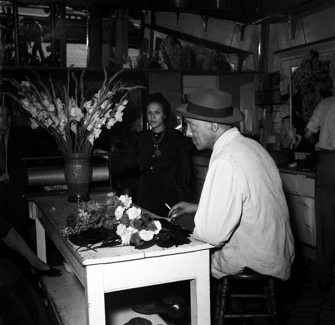 A florist works in her flower shop in Harlem, Manhattan, 1946.