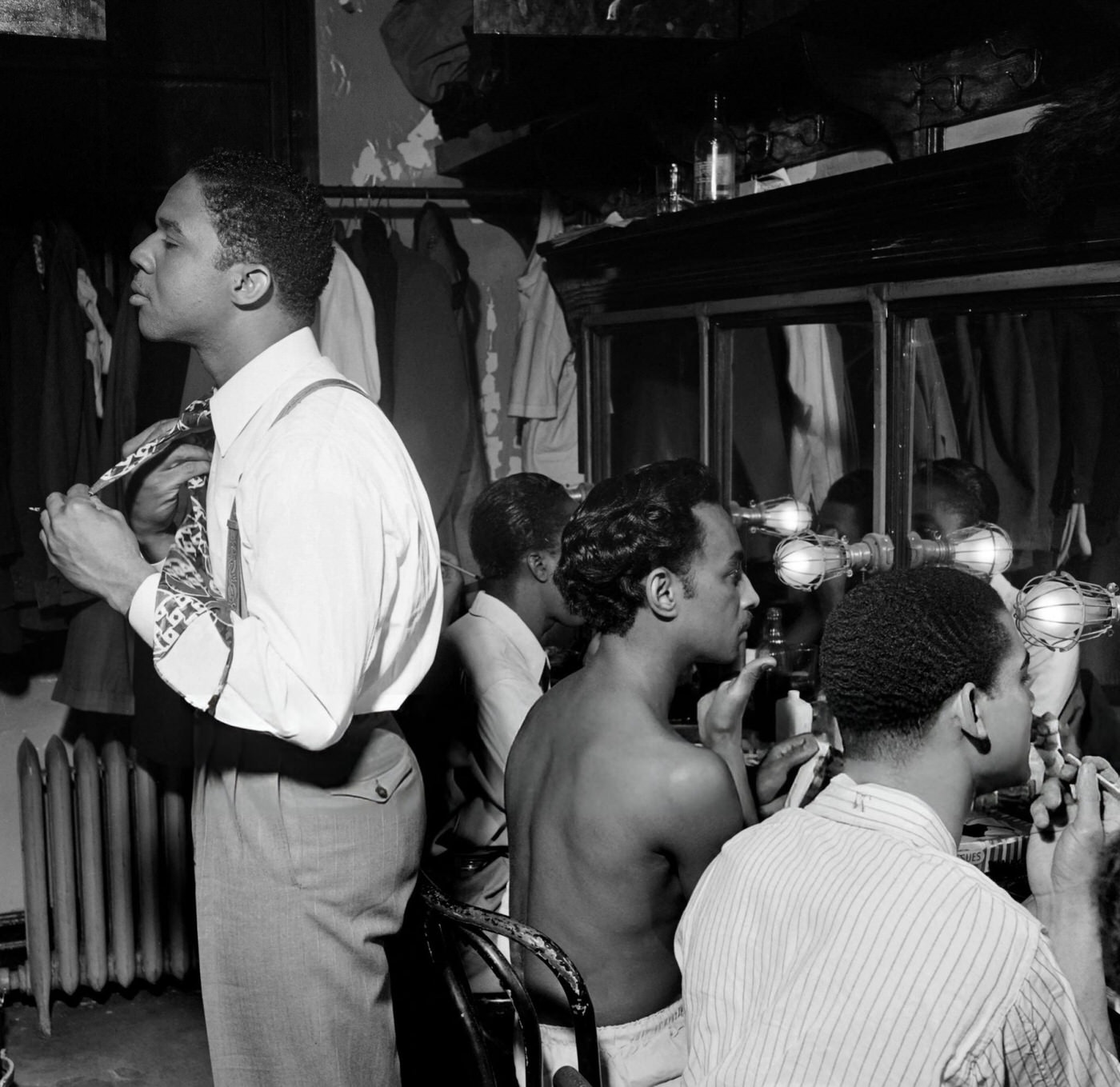 Cabaret dancers prepare in a dressing room in a night club in New York City, 1946.