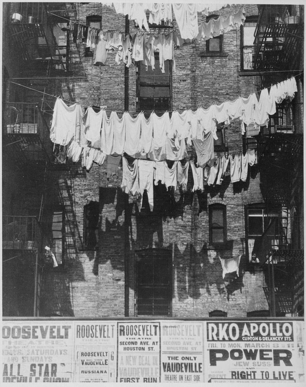 Rows of laundry outside a New York City apartment house, 1935.