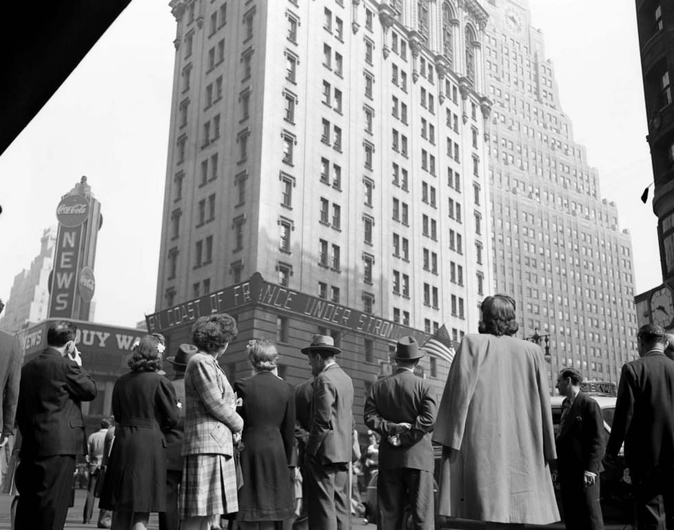 Crowds watching the electronic ticker on the New York Times building in Times Square, waiting for the latest reports.