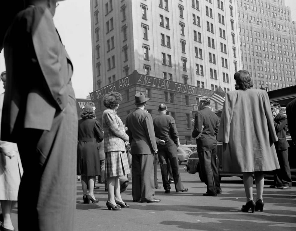 Thousands of people watching the electronic ticker on the New York Times building in Times Square, waiting for the latest reports.