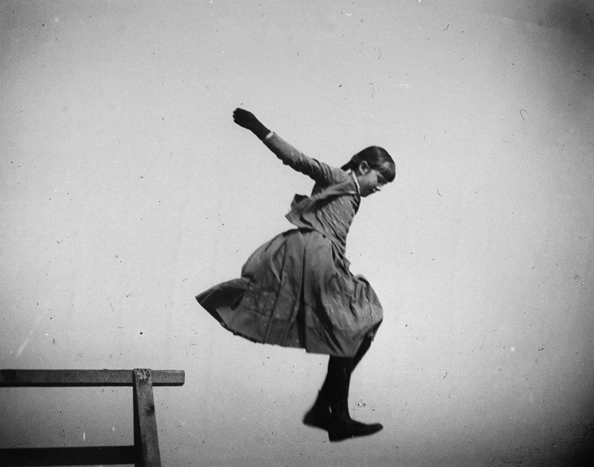 Ethel Merritt jumps in the air at Coney Island, 1886.