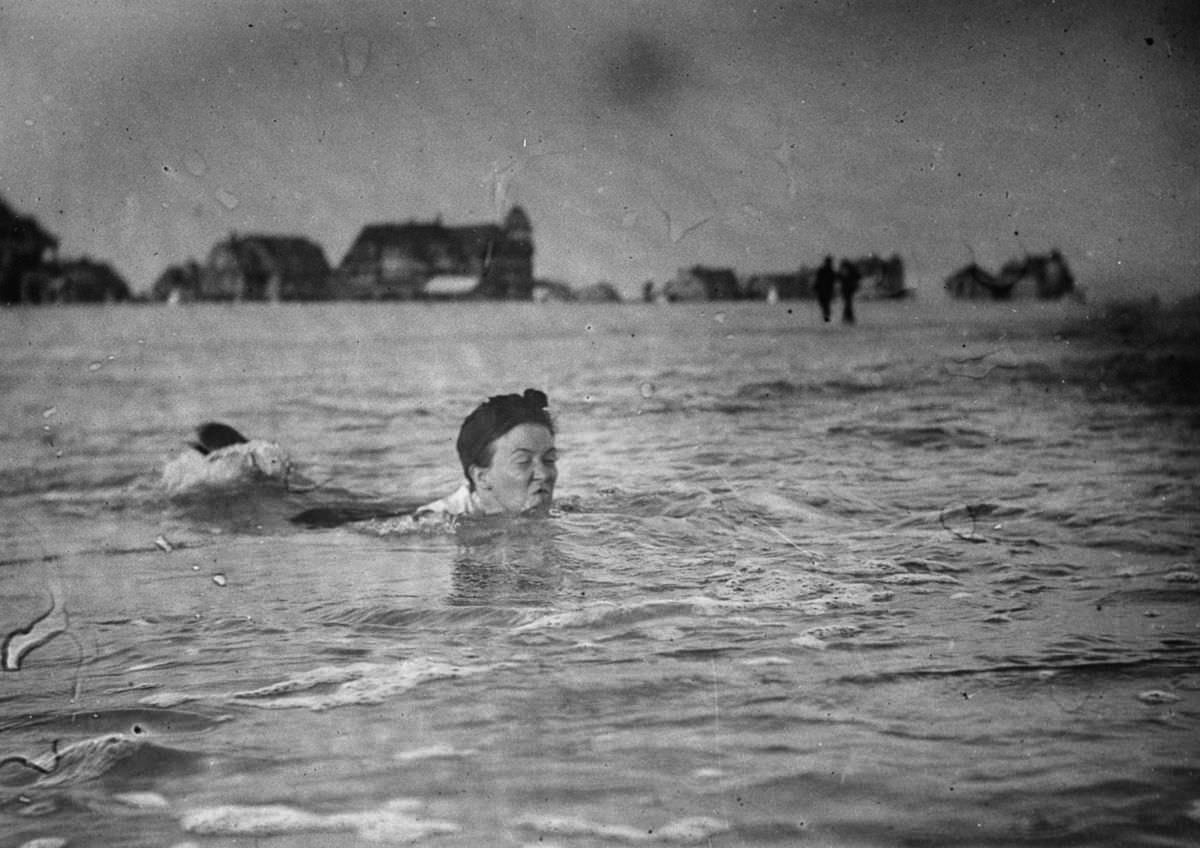 A woman swims at the beach, 1897.