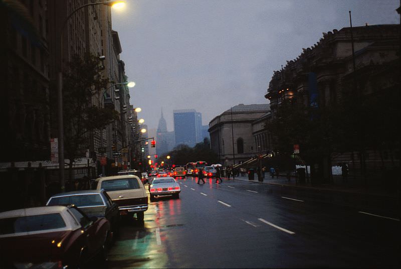 Outside the Metropolitan Museum of Art in the rain at dusk.