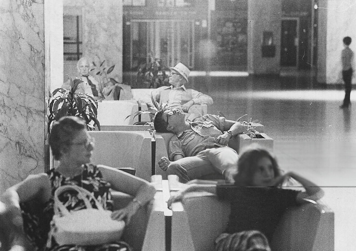 A young man sleeps in the waiting area at LaGuardia Airport during the blackout, 1977.