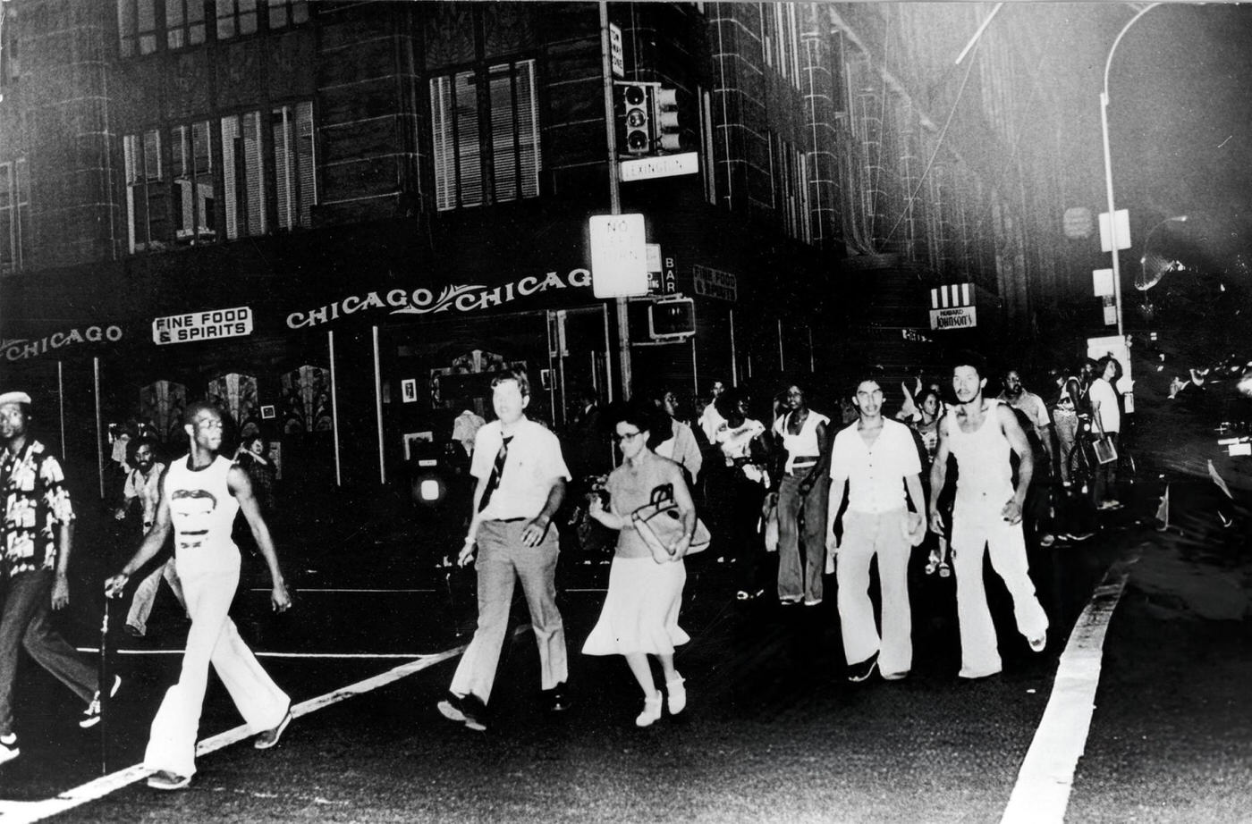 A crowd of New Yorkers make their way home during a power cut, 1977.