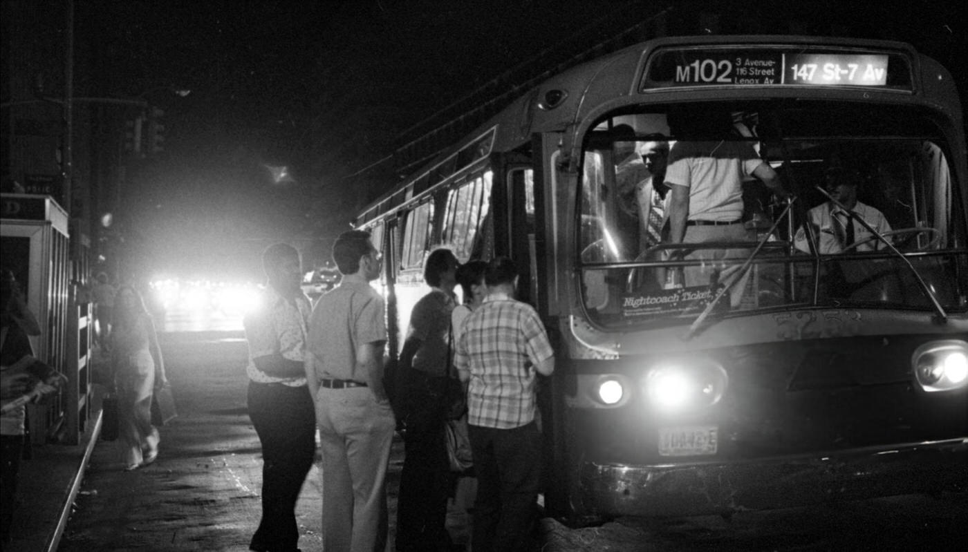 Buses jammed with riders along Seventh Ave during the blackout, 1977.