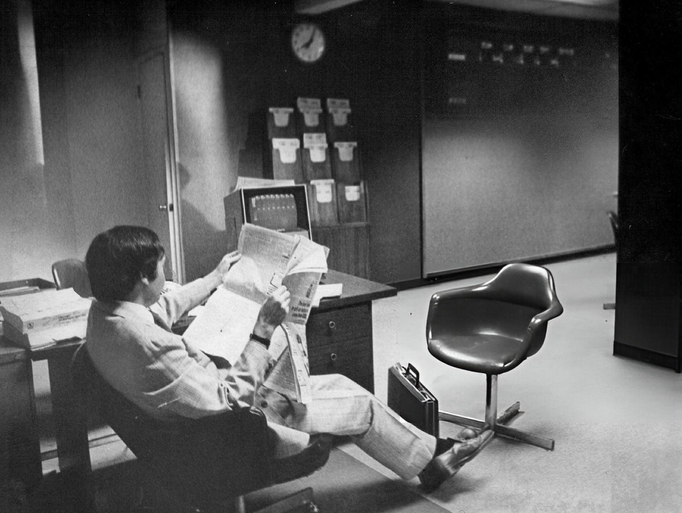 Stock broker Paul R. Esserman gets a break from his normally busy routine because of the New York Blackout, 1977.
