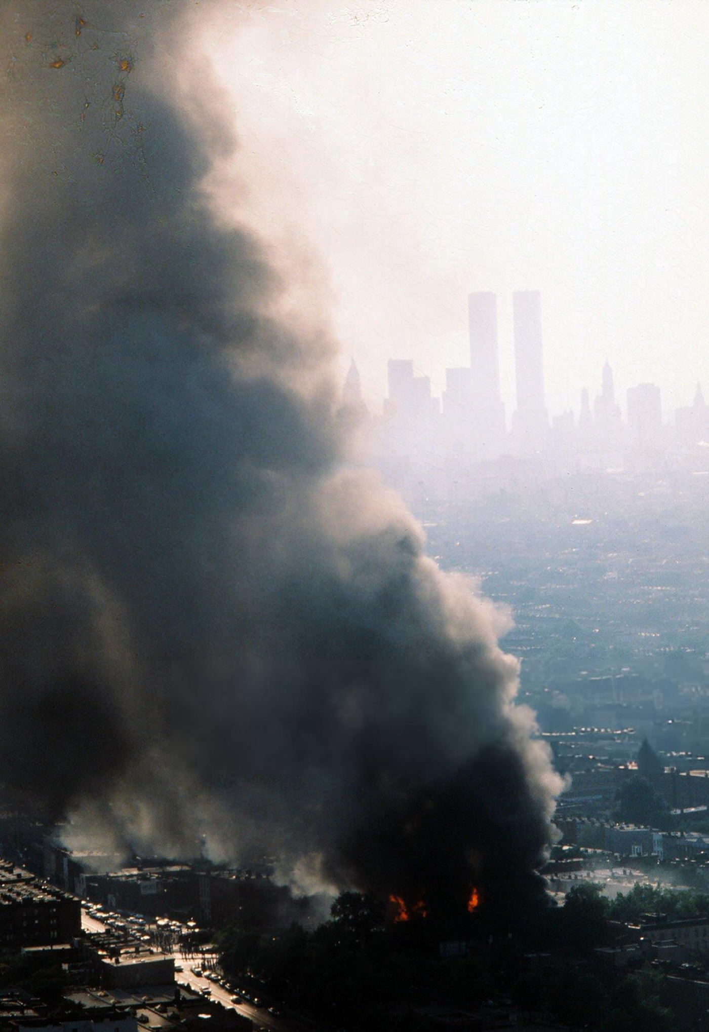 Aerial of a building burning in the wake of the New York City blackout, Brooklyn, 1977.