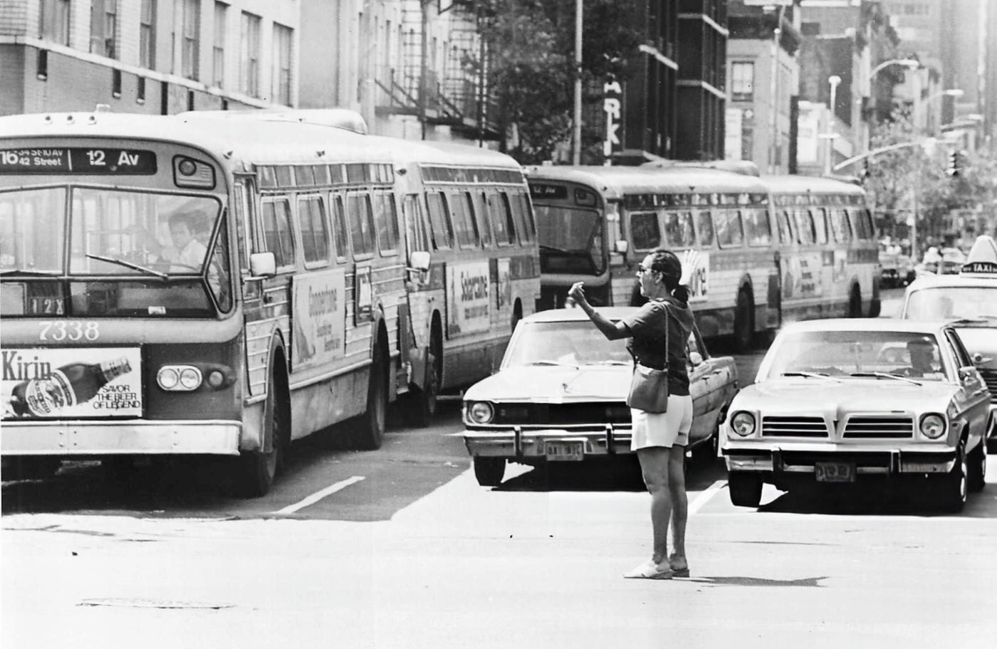 Civilian Helen Glucroft directing traffic on 1st Avenue and 34th Street in Manhattan during the blackout, 1977.