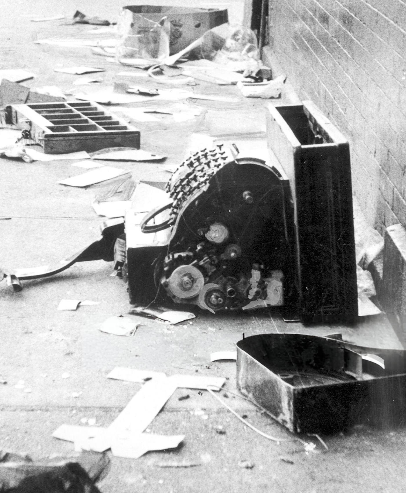 Smashed cash register lies amid debris on a Harlem street after the night of looting during the blackout, 1977.
