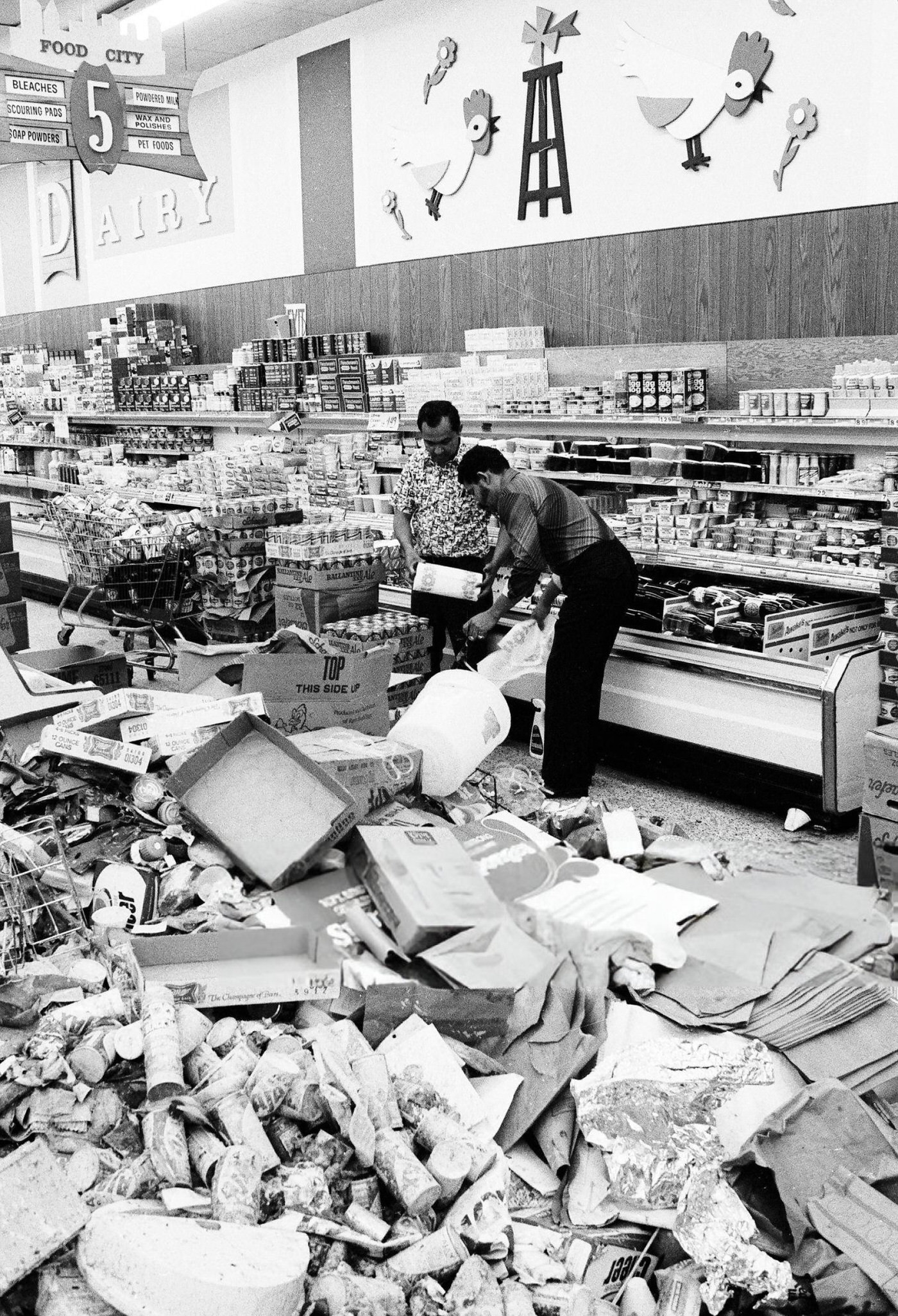 Interior of the Food City supermarket in the Bronx with spoiled food and looted discards after the blackout, 1977.