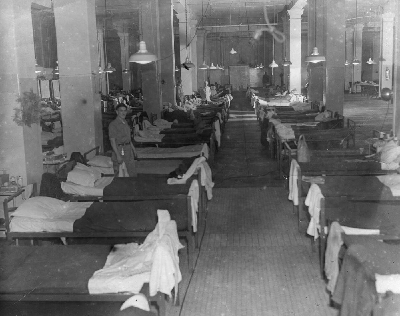 Sleeping quarters for 'alien enemy' seamen detained at Ellis Island during World War II, 1943.