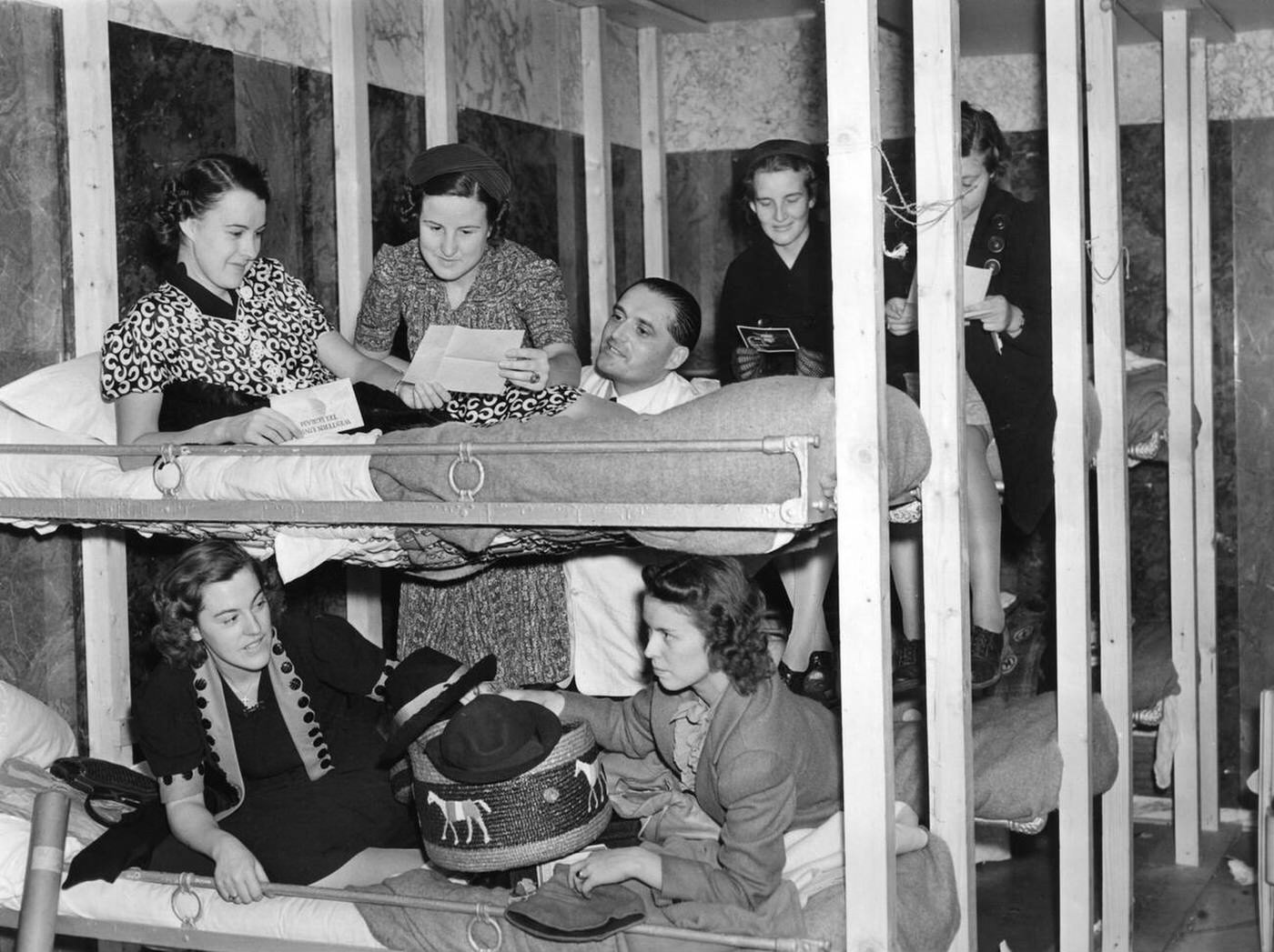 Passengers of the "Ile de France" below deck on the voyage from Europe to New York City, 1939.