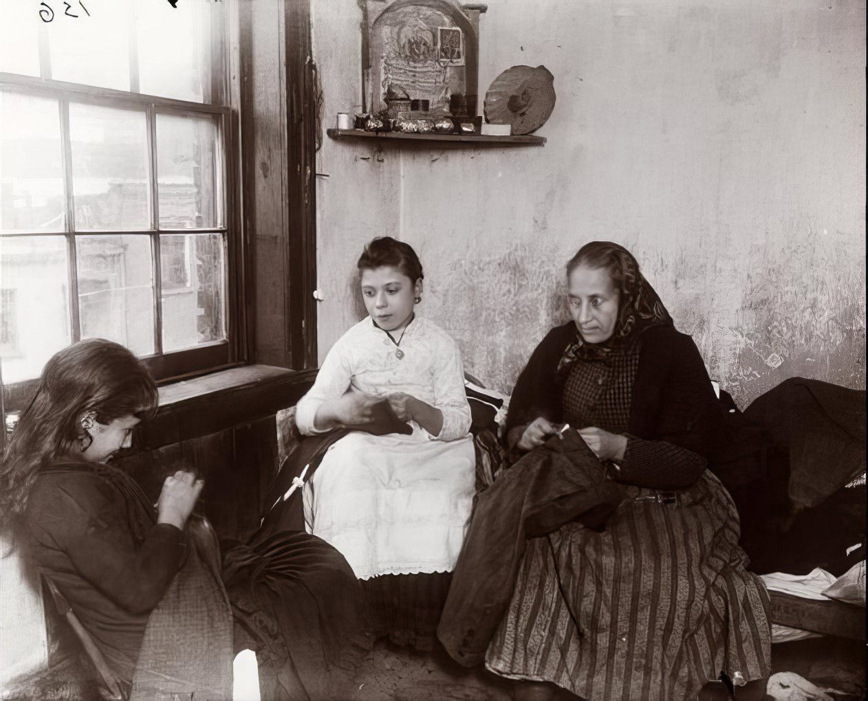 Sewing pants in Gotham Court, 1890.