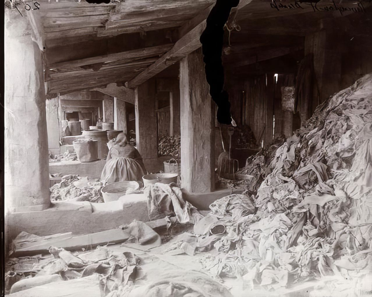 A woman working at the Rivington Street Dump, 1890.