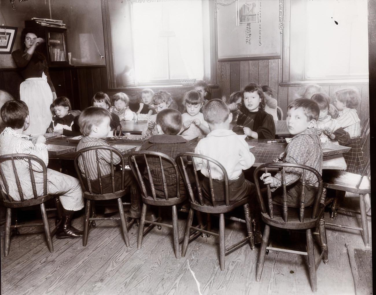 King's Daughters Tenement Chapter kindergarten children threading beads, 1897.