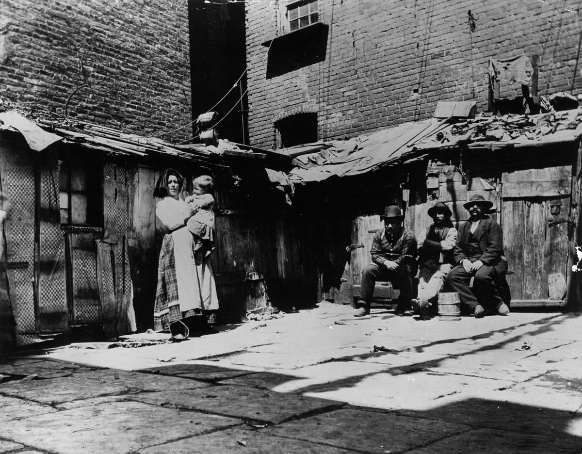 Italian immigrant families living in shacks on Jersey Street, 1897.
