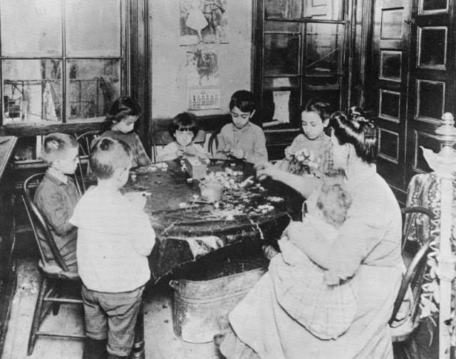 A family making artificial flowers.
