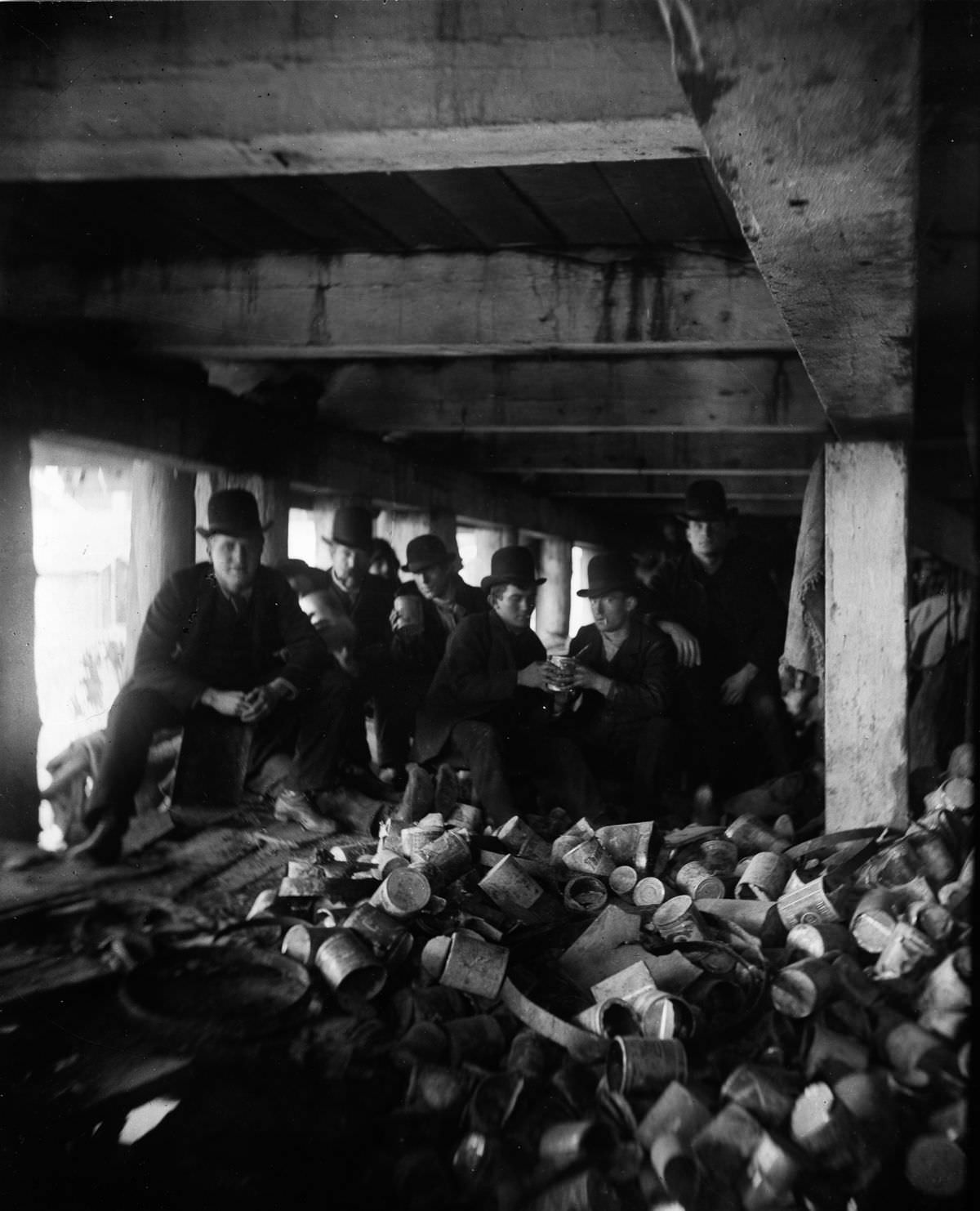 Members of the "Short Tail" gang gather under the pier at the foot of Jackson Street, 1887.