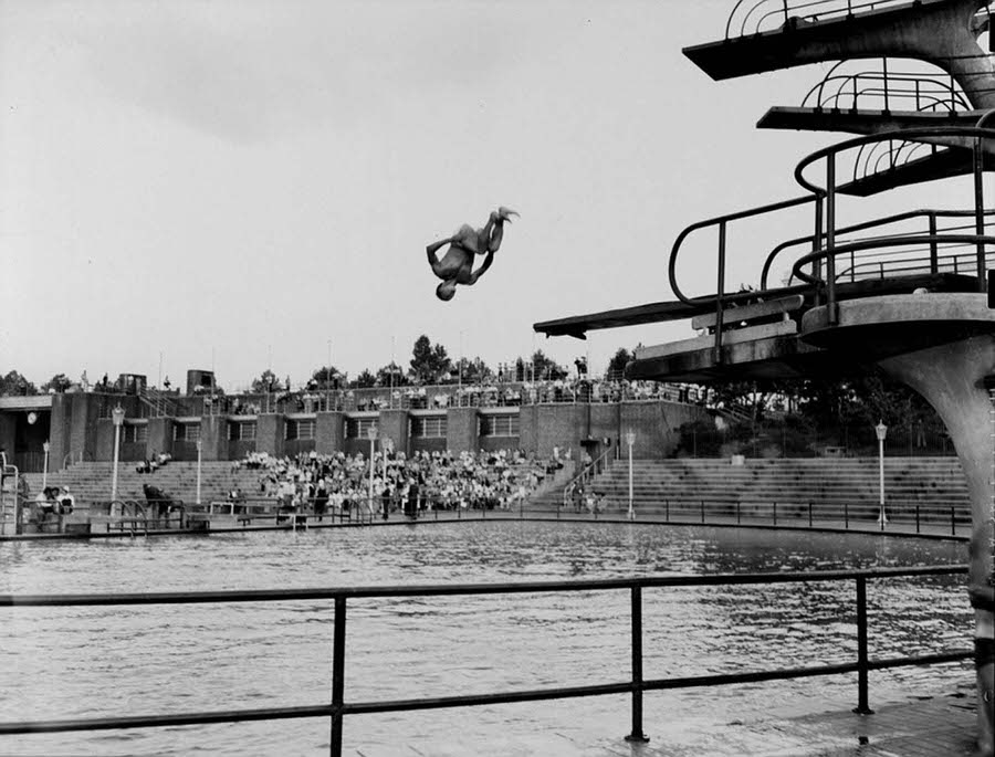A young man completing an incredible dive during a competition at Astoria pool, 1943.