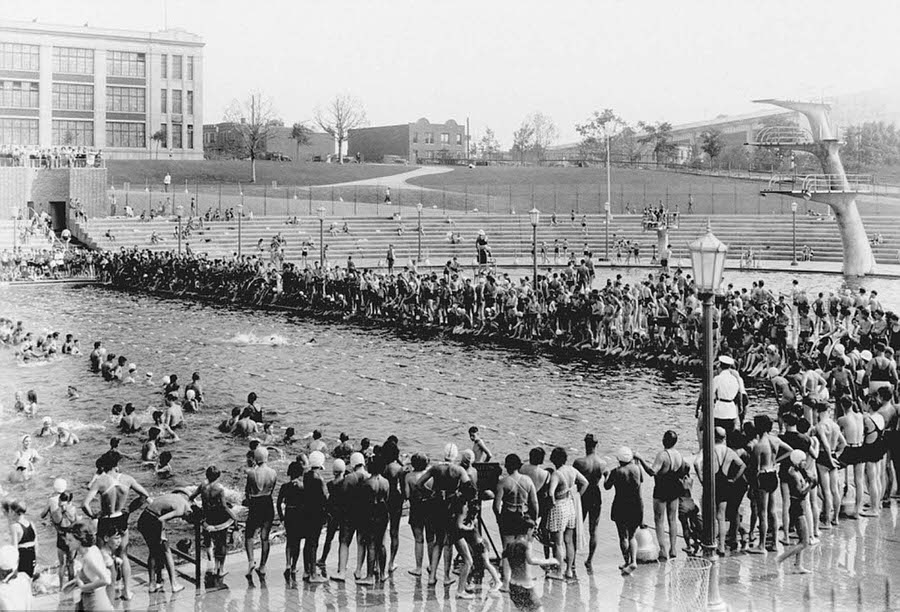 Dozens of New Yorkers gather around the Astoria pool during a swim competition, 1936.