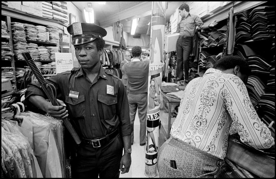 A security guard at a clothing store, 1972.