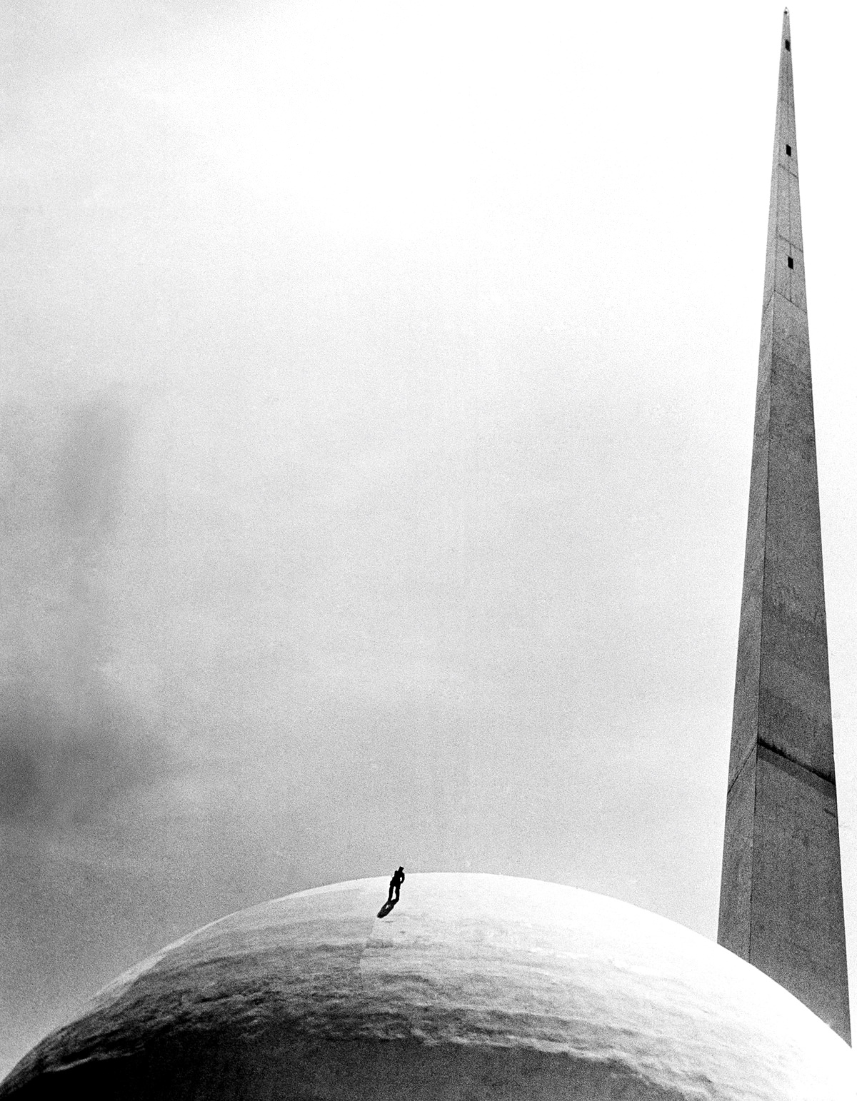 A workman repaints the famed Perisphere at New York World's Fair, 1939.