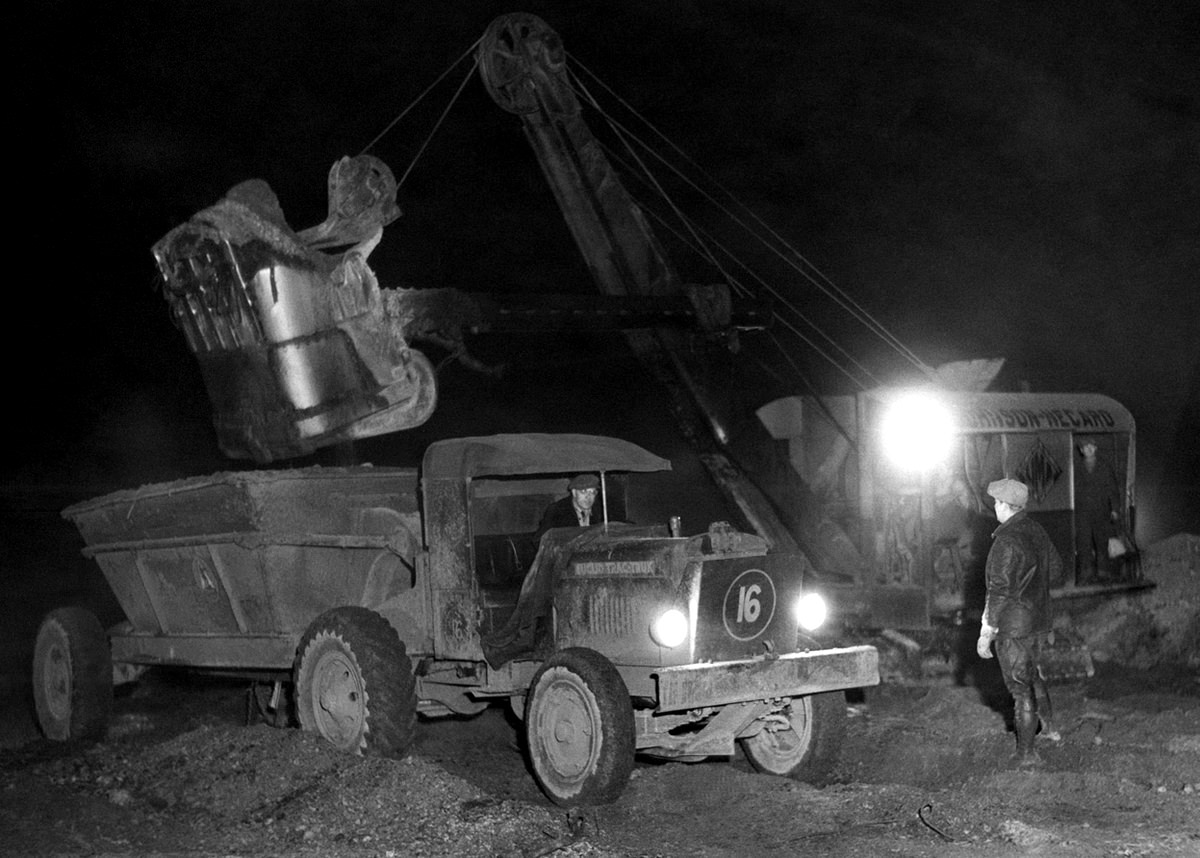 Shifts covering a 24-hour period were in effect for filling in land for the New York World's Fair in Flushing, 1936.