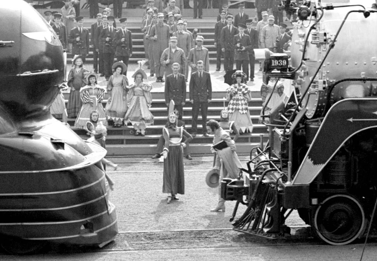 End of the railroad pageant, as a "woman of the future" brings together performers, 1939.