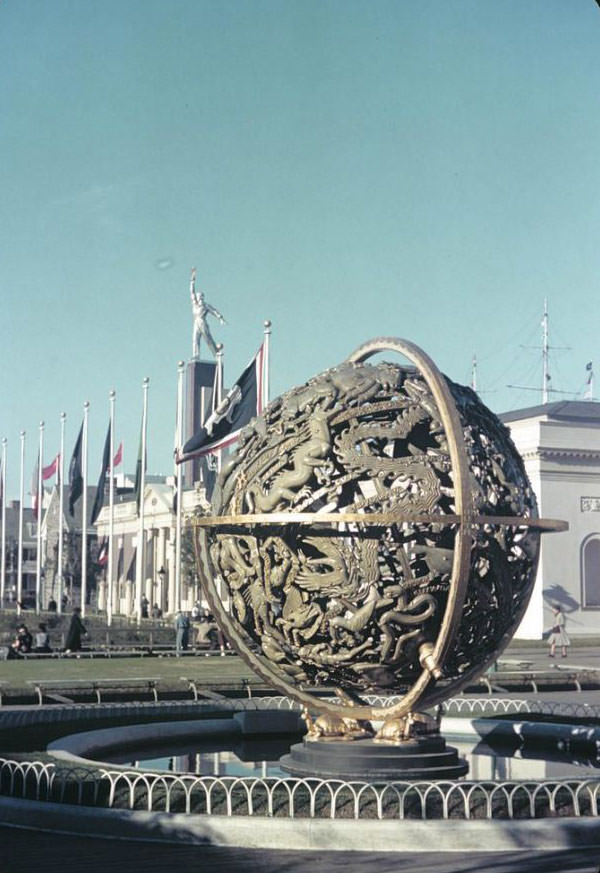Globe along the Court of States, in front of the West Virginia and Georgia buildings with tower of the USSR (Soviet) Pavilion, 1939 New York World's Fair.