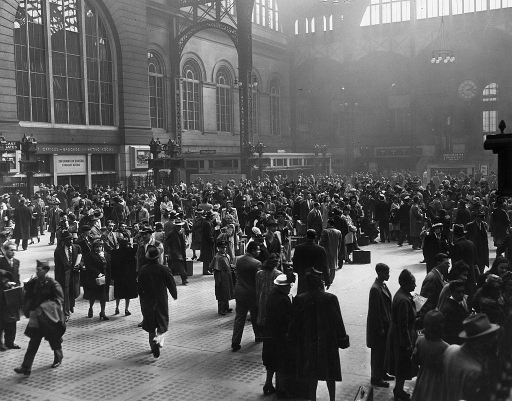 View of a crowd of people in the interior of the old Pennsylvania Rail Road Station, New York City, 1950.