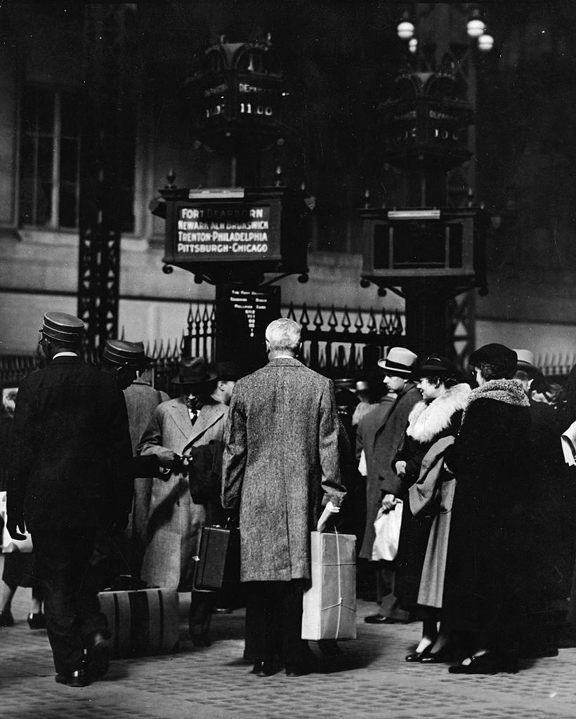 Commuters wait for the train at Penn Station, New York, 1940s.