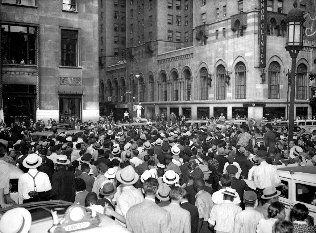Crowd outside Pennsylvania Station wait to see the Scottsboro boys, 1940.