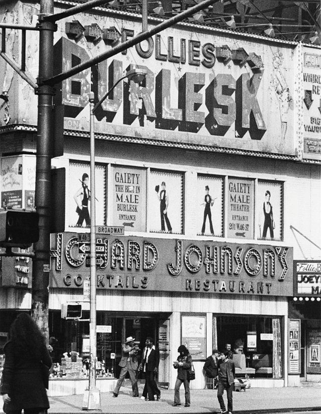 A sign for the Gaiety Male Theater above a Howard Johnson's restaurant, 46th Street and Broadway, 1978.