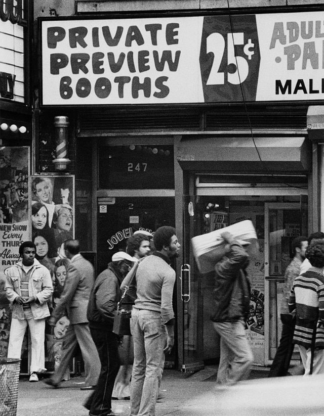 A peep show advertisement offers “Private Preview Booths” in New York City, circa 1978.