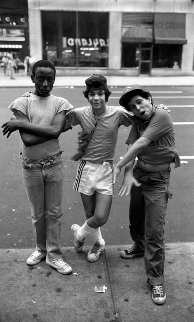 Three boy prostitutes pose for the camera as they wait for customers in Times Square.