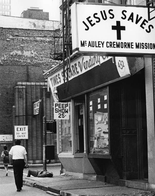 A homeless man sleeps on the sidewalk in front of the McAuley Cremorne Mission, Times Square, 1985.