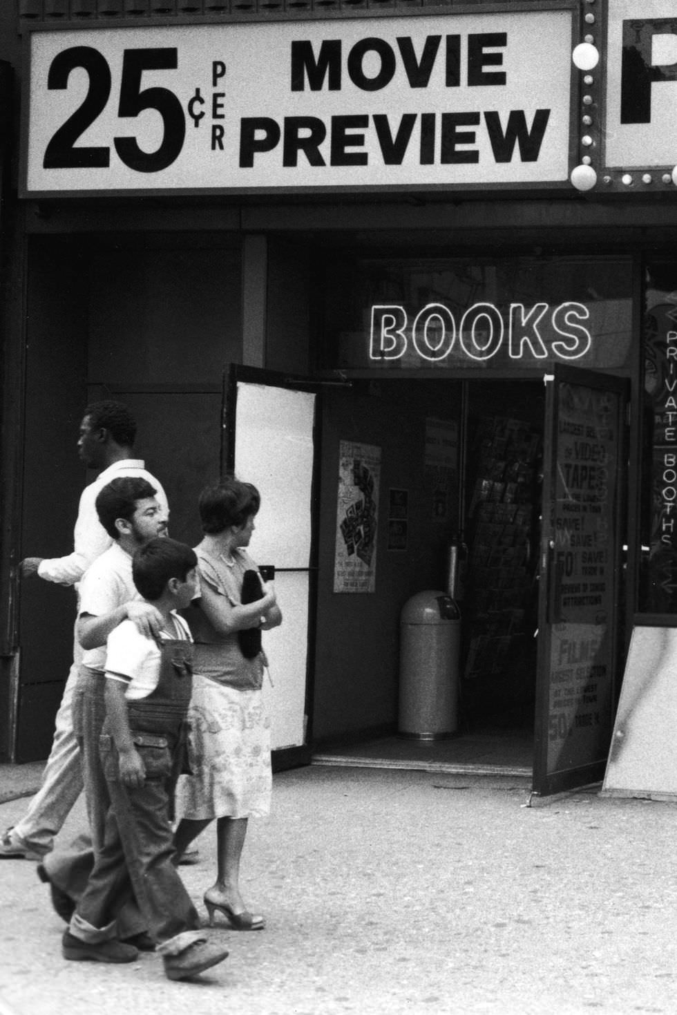 A family walks by a storefront boasting “the world’s largest selection of live nude girl models,” in 1970. The contrast between family life and the sex trade was stark.