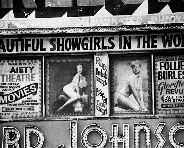 Posters for burlesque shows at the Follies Burlesk and Gaiety Theater, Times Square, 1975.