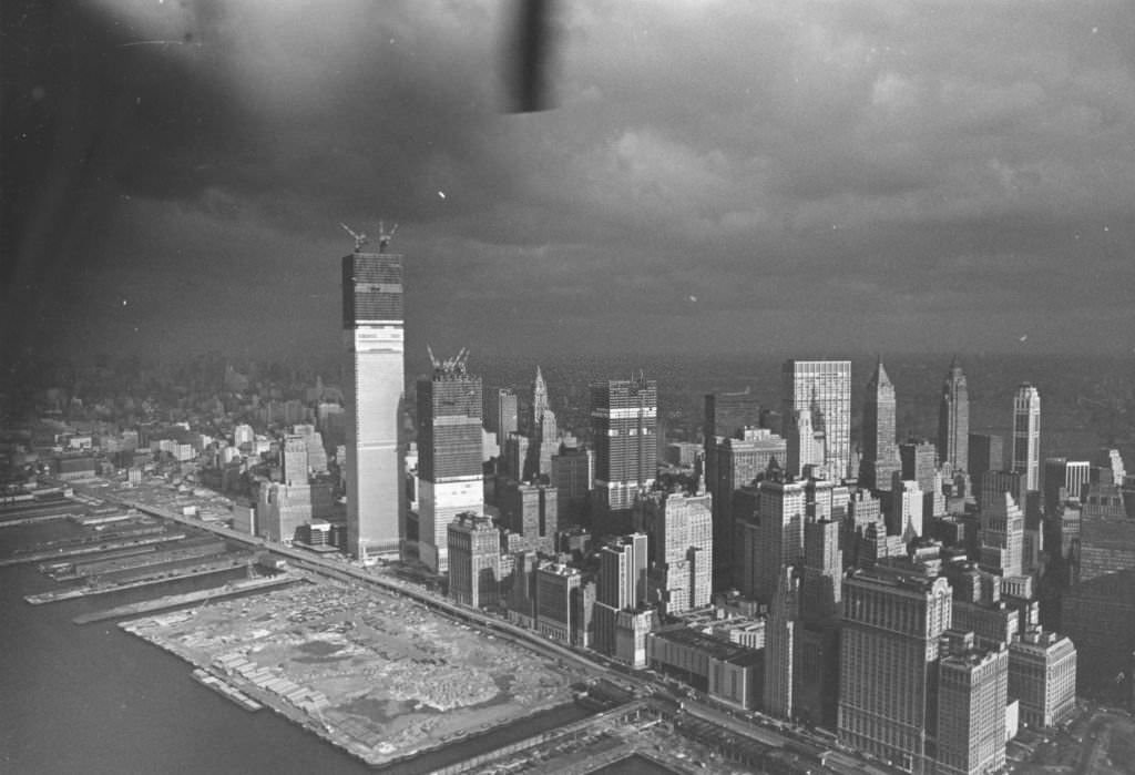 Storm clouds over the New York skyline, where the World Trade Center is under construction.