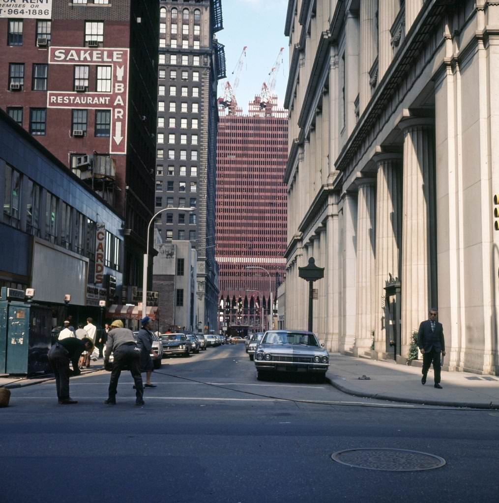 View of the construction of One World Trade Center (North Tower) along Dey Street, 1969.