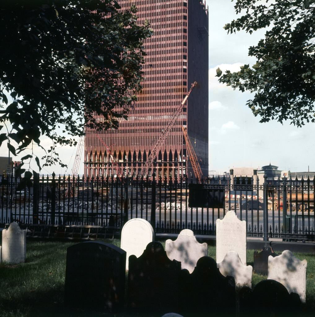 View of the construction of One World Trade Center (North Tower) across gravestones outside St Paul's Chapel, 1969.