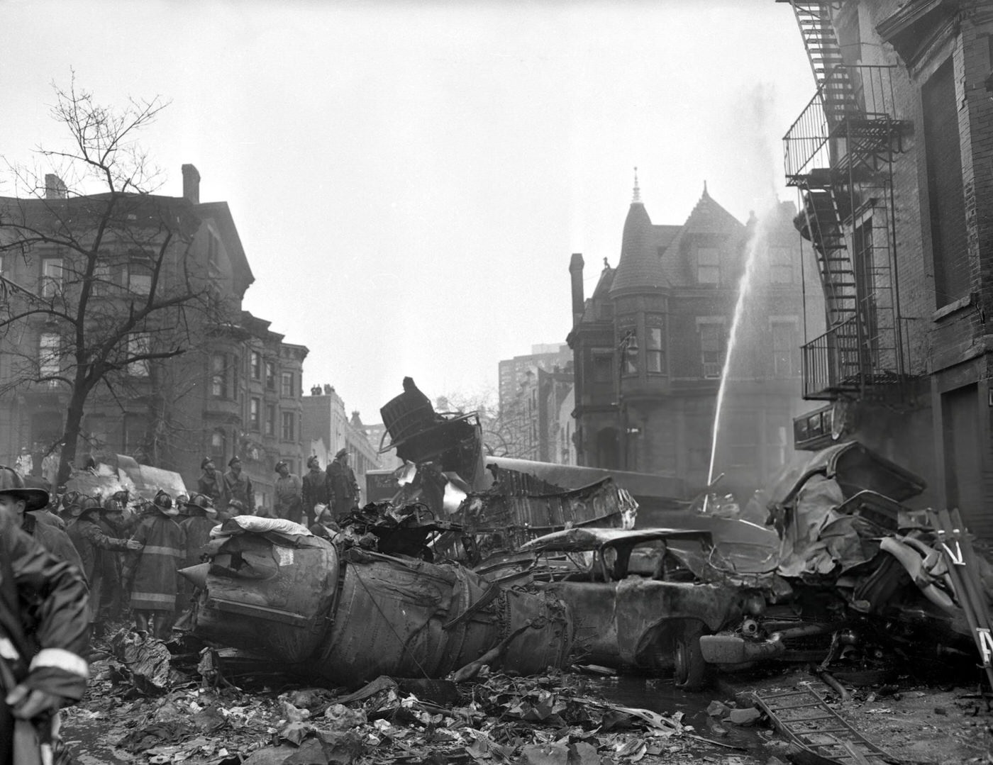 One Of The Jet Engines Of The United Airlines Craft Lies Next To A Gutted Car At Seventh Ave. And Sterling Place, Brooklyn After The United Airlines Dc-8 &Amp;Amp; Twa Super Constellation Aviation Accident, 1960.